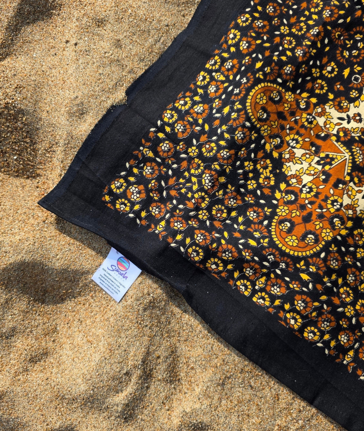 Detail of the Desert Sand giant cotton beach mat's hand-dyed texture and fringe