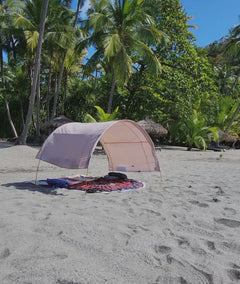 Suniela shade cabana standing strong on a very windy beach.
