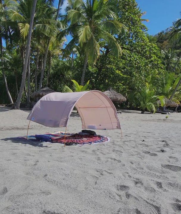Suniela shade cabana standing strong on a very windy beach.
