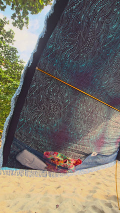 video showing the large pockets and ocean waves pattern detail on a cotton Suniela shade canopy